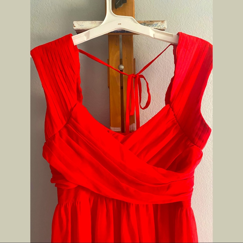 Short red dress with pleats and ruching, cap sleeves with tie in back